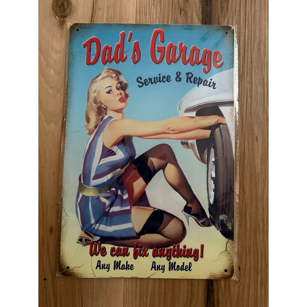 Pinup "Dad's Garage - We Can Fix Anything!" Metal Sign